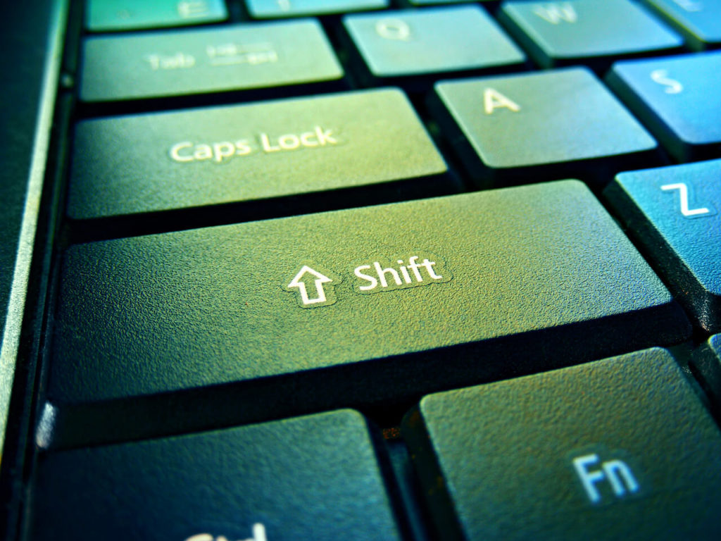 How did the Policy Regarding the Capitalization of "Black" and "White" Change? Keyboard focused on "Shift" key.